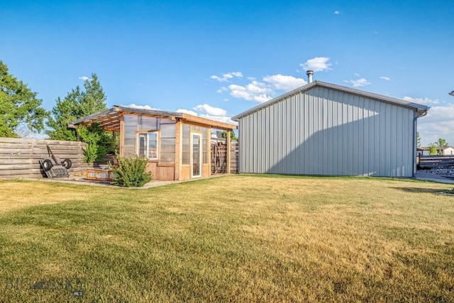 191 Barnes Dr, Belgrade, MT 59714 - rear view of house featuring an outdoor structure and an exterior structure