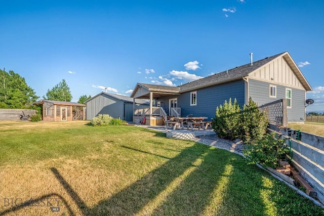 191 Barnes Dr, Belgrade, MT 59714 - back of house featuring board and batten siding and a patio