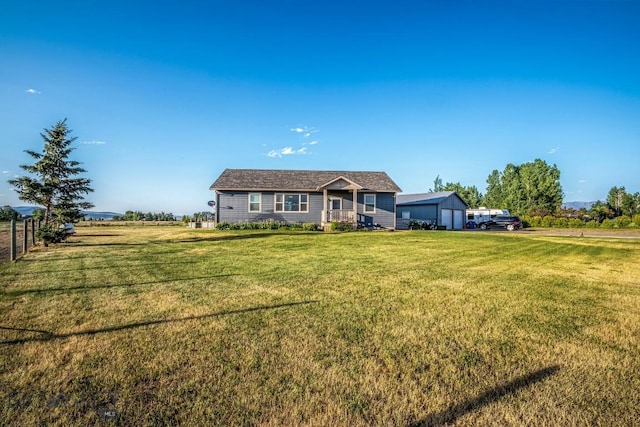 191 Barnes Dr, Belgrade, MT 59714 - single story home with a front lawn and a detached garage