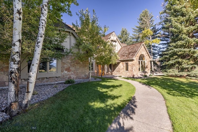 2421 Highland Blvd, Bozeman, MT 59715 - view of front of house featuring stone siding and a front yard