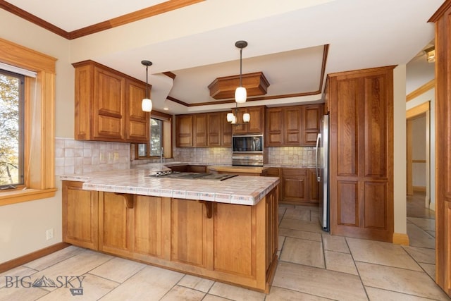 2421 Highland Blvd, Bozeman, MT 59715 - kitchen featuring a peninsula, freestanding refrigerator, black microwave, a raised ceiling, and healthy amount of natural light