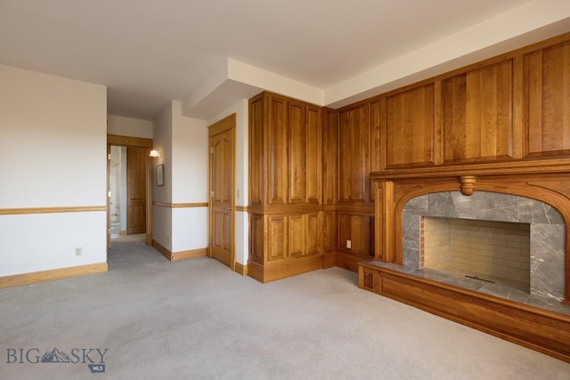 2421 Highland Blvd, Bozeman, MT 59715 - unfurnished living room with light carpet, a fireplace, and baseboards