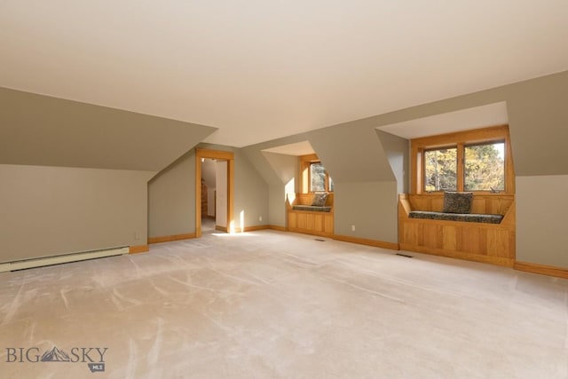 2421 Highland Blvd, Bozeman, MT 59715 - additional living space with baseboard heating, vaulted ceiling, light carpet, and baseboards