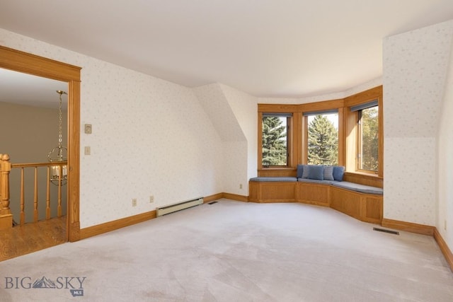 2421 Highland Blvd, Bozeman, MT 59715 - additional living space featuring wallpapered walls, a baseboard heating unit, light carpet, and baseboards