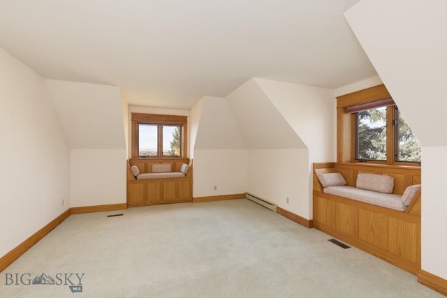 2421 Highland Blvd, Bozeman, MT 59715 - additional living space featuring baseboard heating, vaulted ceiling, light colored carpet, and baseboards