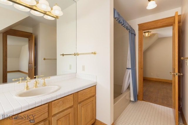 2421 Highland Blvd, Bozeman, MT 59715 - full bath featuring vanity, shower / tub combo, tile patterned flooring, and lofted ceiling