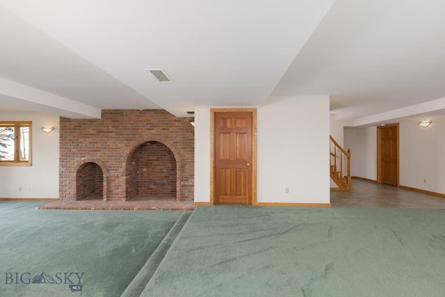 2421 Highland Blvd, Bozeman, MT 59715 - unfurnished living room featuring carpet flooring, a brick fireplace, stairs, and baseboards