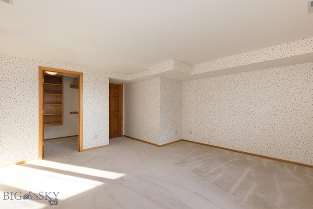 2421 Highland Blvd, Bozeman, MT 59715 - unfurnished room featuring light colored carpet, wallpapered walls, and baseboards