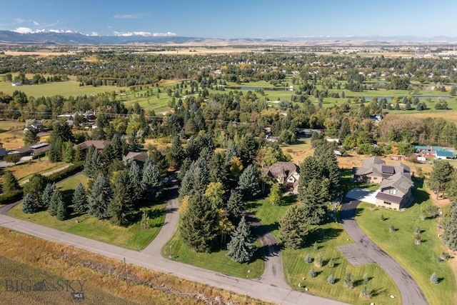 2421 Highland Blvd, Bozeman, MT 59715 - aerial view of property's location with a mountain backdrop and a tree filled landscape