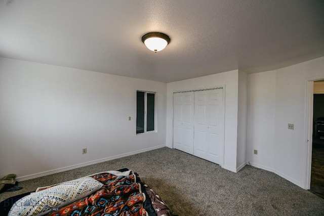 2373 Mt Highway 278, Dillon, MT 59725 - unfurnished bedroom with carpet, baseboards, a closet, and a textured ceiling