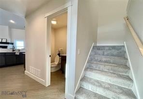 17 Durango Trl, Three Forks, MT 59752 - staircase with baseboards and wood finished floors