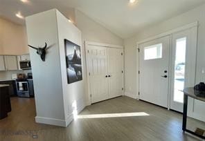 17 Durango Trl, Three Forks, MT 59752 - foyer featuring baseboards, vaulted ceiling, and dark wood finished floors