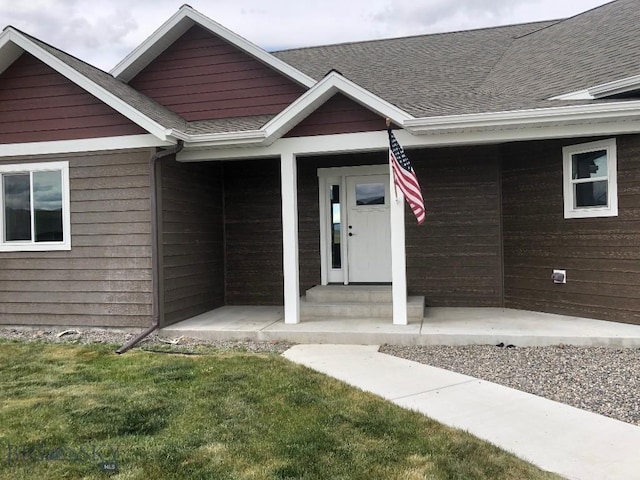 17 Durango Trl, Three Forks, MT 59752 - property entrance featuring roof with shingles and a lawn