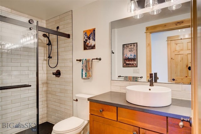 424 E Main St Unit E, Bozeman, MT 59715 - bathroom with a tile shower, vanity, and toilet