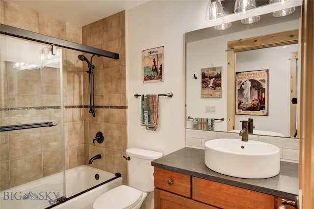 424 E Main St Unit E, Bozeman, MT 59715 - bathroom with toilet, vanity, and enclosed tub / shower combo