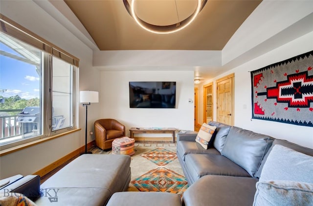 424 E Main St Unit E, Bozeman, MT 59715 - living area with lofted ceiling, healthy amount of natural light, and baseboards
