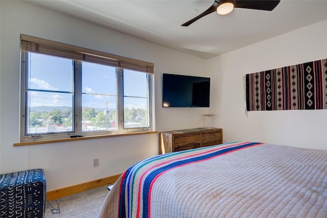 424 E Main St Unit E, Bozeman, MT 59715 - carpeted bedroom featuring multiple windows and ceiling fan