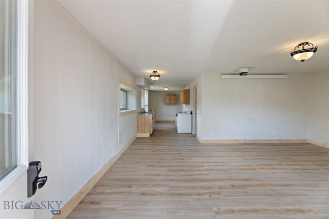 312 Water St, Gardiner, MT 59030 - unfurnished living room featuring light wood-type flooring and baseboards