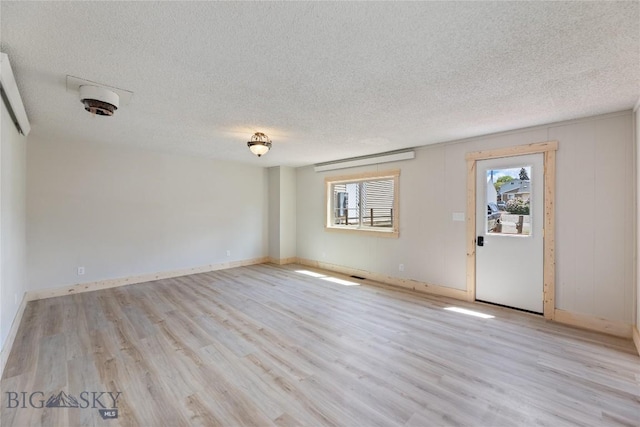 312 Water St, Gardiner, MT 59030 - empty room featuring a textured ceiling and wood finished floors
