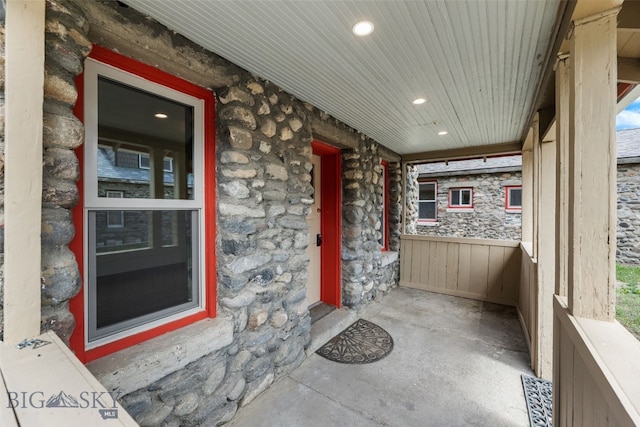 504 4th St, Gardiner, MT 59030 - doorway to property featuring stone siding and a porch
