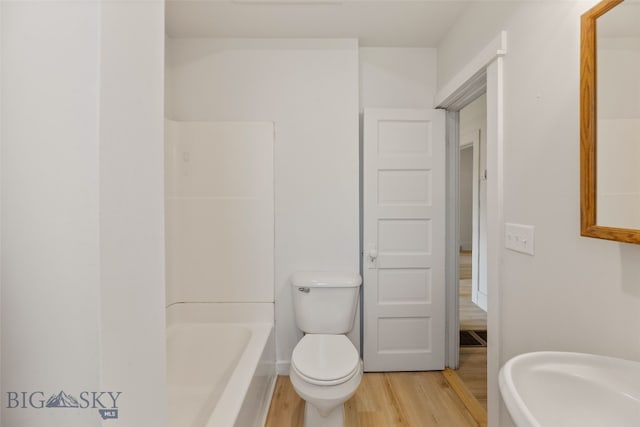 504 4th St, Gardiner, MT 59030 - full bathroom with wood finished floors and shower / washtub combination