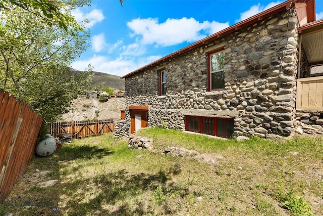 504 4th St, Gardiner, MT 59030 - back of property with stone siding and a mountain view