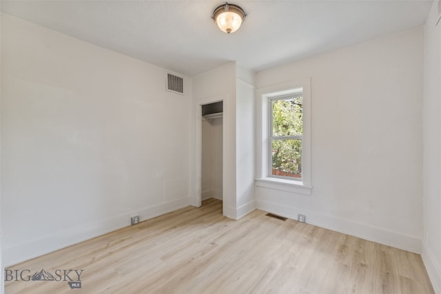 504 4th St, Gardiner, MT 59030 - unfurnished bedroom featuring wood finished floors and a closet