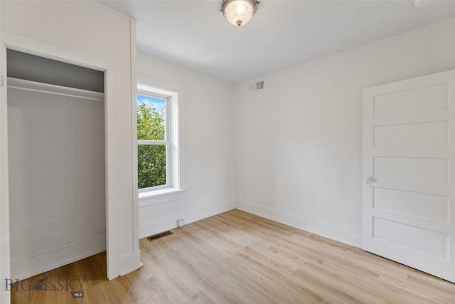 504 4th St, Gardiner, MT 59030 - unfurnished bedroom featuring light wood-type flooring, baseboards, and a closet
