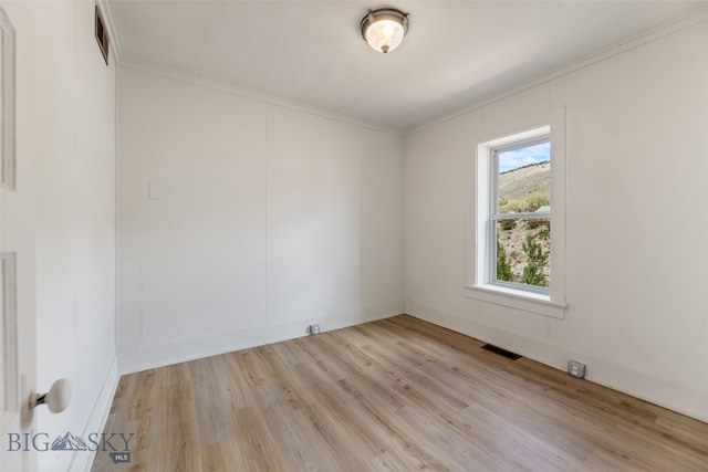 504 4th St, Gardiner, MT 59030 - empty room with ornamental molding and light wood-style flooring