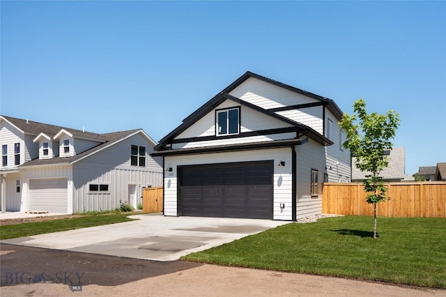 1505 Pistolero Way, Belgrade, MT 59714 - view of front facade with driveway and a garage