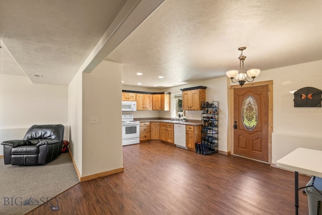 205 Water St, Sheridan, MT 59749 - kitchen featuring white appliances, open floor plan, dark wood finished floors, a textured ceiling, and baseboards
