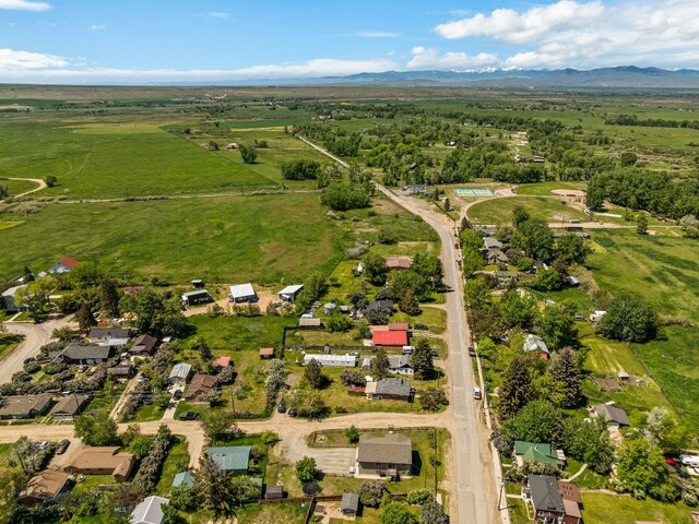 205 Water St, Sheridan, MT 59749 - aerial overview of property's location featuring a mountain backdrop and rural landscape