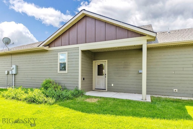 2430 Ferguson Ave, Bozeman, MT 59718 - back of house with a yard, a patio area, a shingled roof, and board and batten siding