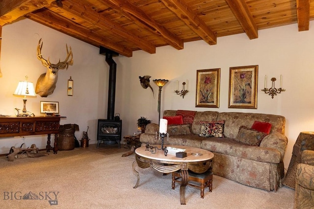 16 Wilson Rd, Livingston, MT 59047 - living area with wood ceiling with exposed beams, a wood stove, and carpet
