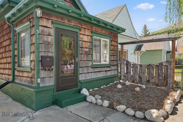 511 Alder St, Anaconda, MT 59711 - property entrance with a shingled roof