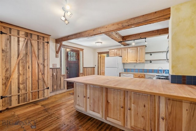 511 Alder St, Anaconda, MT 59711 - kitchen featuring white appliances, light brown cabinets, a wainscoted wall, butcher block counters, and a peninsula