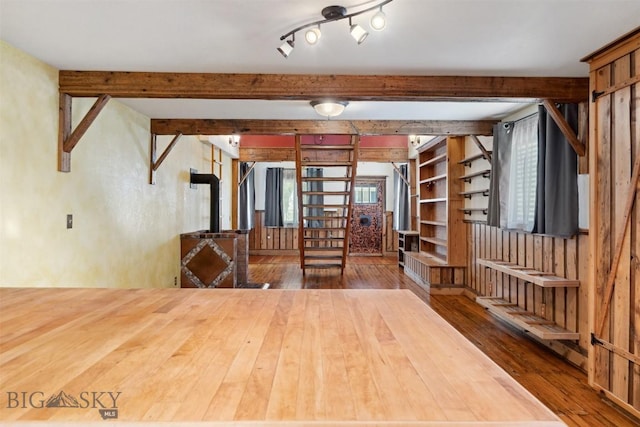 511 Alder St, Anaconda, MT 59711 - empty room with hardwood / wood-style flooring and beamed ceiling