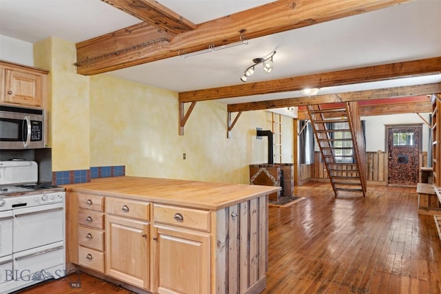 511 Alder St, Anaconda, MT 59711 - kitchen with white range with gas cooktop, stainless steel microwave, beam ceiling, light brown cabinetry, and wood-type flooring