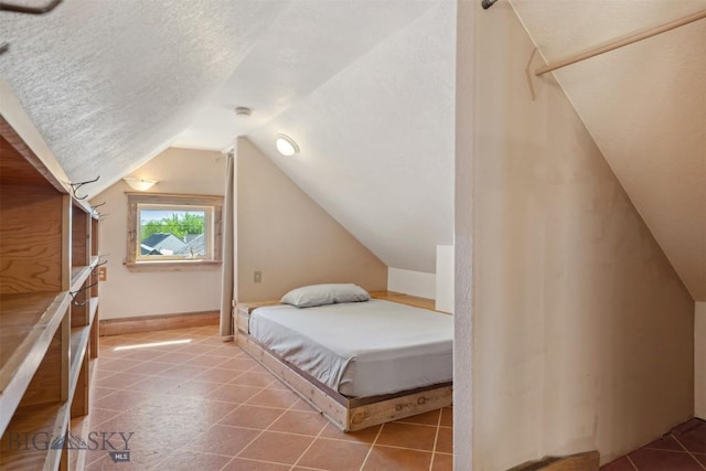 511 Alder St, Anaconda, MT 59711 - bedroom featuring vaulted ceiling and baseboards