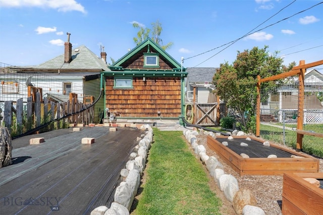 511 Alder St, Anaconda, MT 59711 - view of yard featuring a vegetable garden and an outbuilding