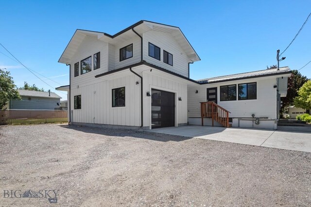 420 N 6th Ave, Bozeman, MT 59715 - modern farmhouse with driveway, board and batten siding, and an attached garage