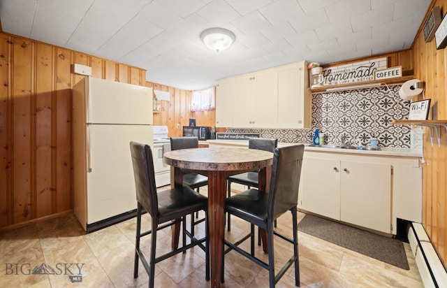 420 N 6th Ave, Bozeman, MT 59715 - dining space featuring wooden walls and baseboard heating