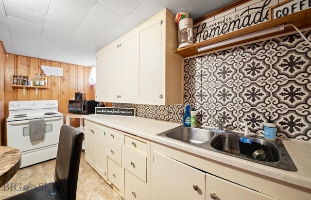 420 N 6th Ave, Bozeman, MT 59715 - kitchen featuring white electric range oven, light countertops, wooden walls, tasteful backsplash, and white cabinets