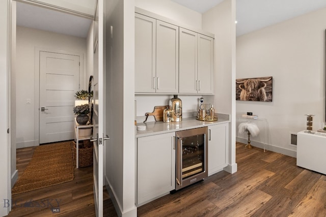 47 Wickwire, Bozeman, MT 59718 - indoor dry bar with beverage cooler, dark wood finished floors, and baseboards