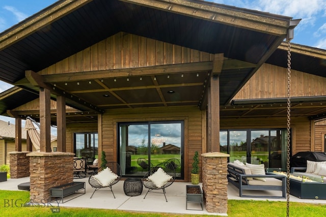 47 Wickwire, Bozeman, MT 59718 - back of house featuring a patio area, outdoor lounge area, and board and batten siding