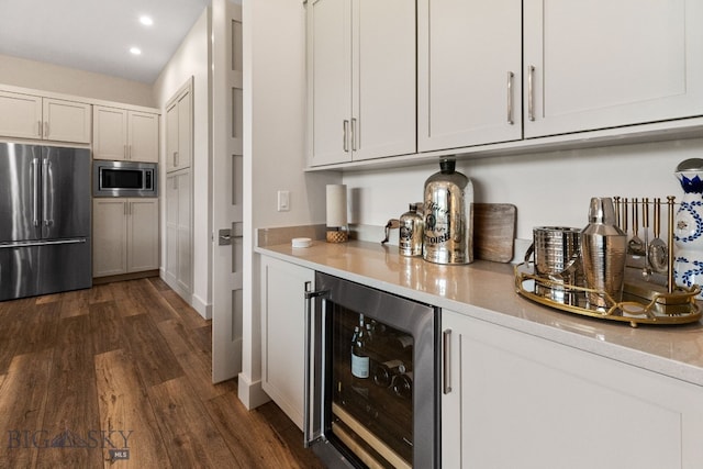 47 Wickwire, Bozeman, MT 59718 - indoor dry bar with appliances with stainless steel finishes, wine cooler, recessed lighting, and dark wood-type flooring