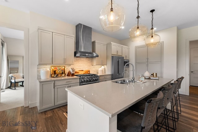 47 Wickwire, Bozeman, MT 59718 - kitchen featuring wall chimney range hood, high quality appliances, a sink, and dark wood-style floors