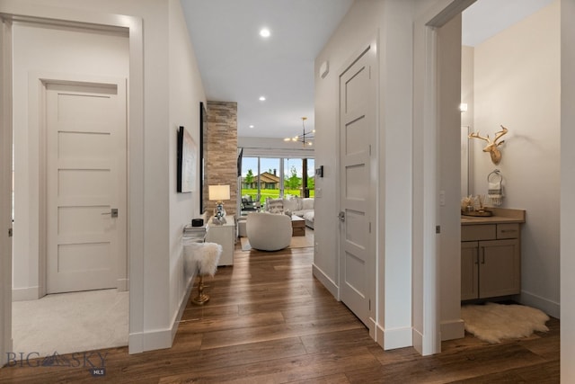 47 Wickwire, Bozeman, MT 59718 - hall with dark wood-style flooring, baseboards, a chandelier, and recessed lighting