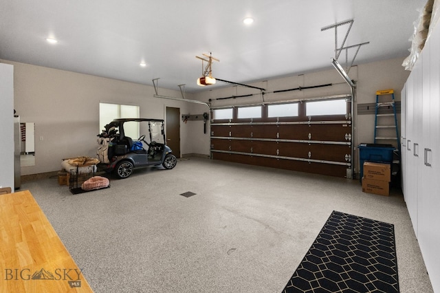 47 Wickwire, Bozeman, MT 59718 - garage featuring a garage door opener and recessed lighting