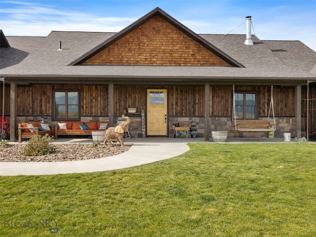 289 Montana Way, Ennis, MT 59729 - rear view of property featuring roof with shingles, an outdoor living space, and a yard